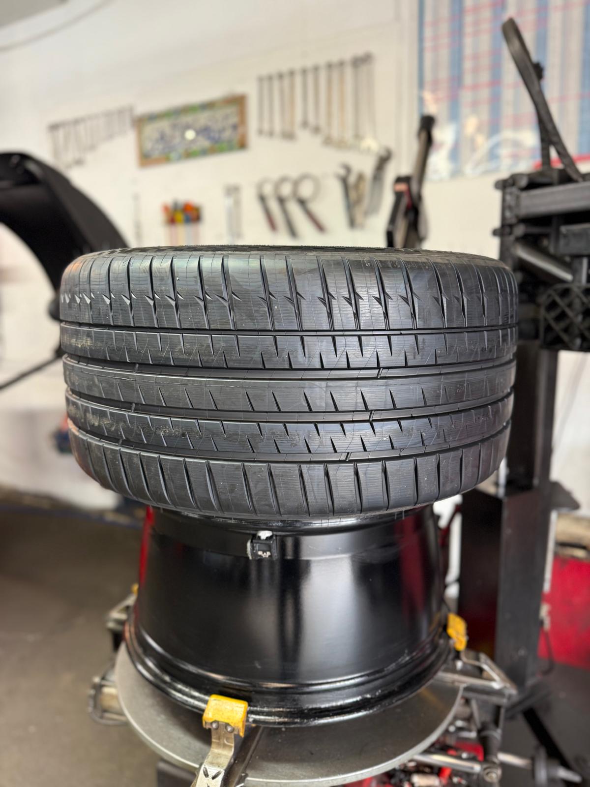A fresh Michelin going on the machine at RS Tyres, Burnley