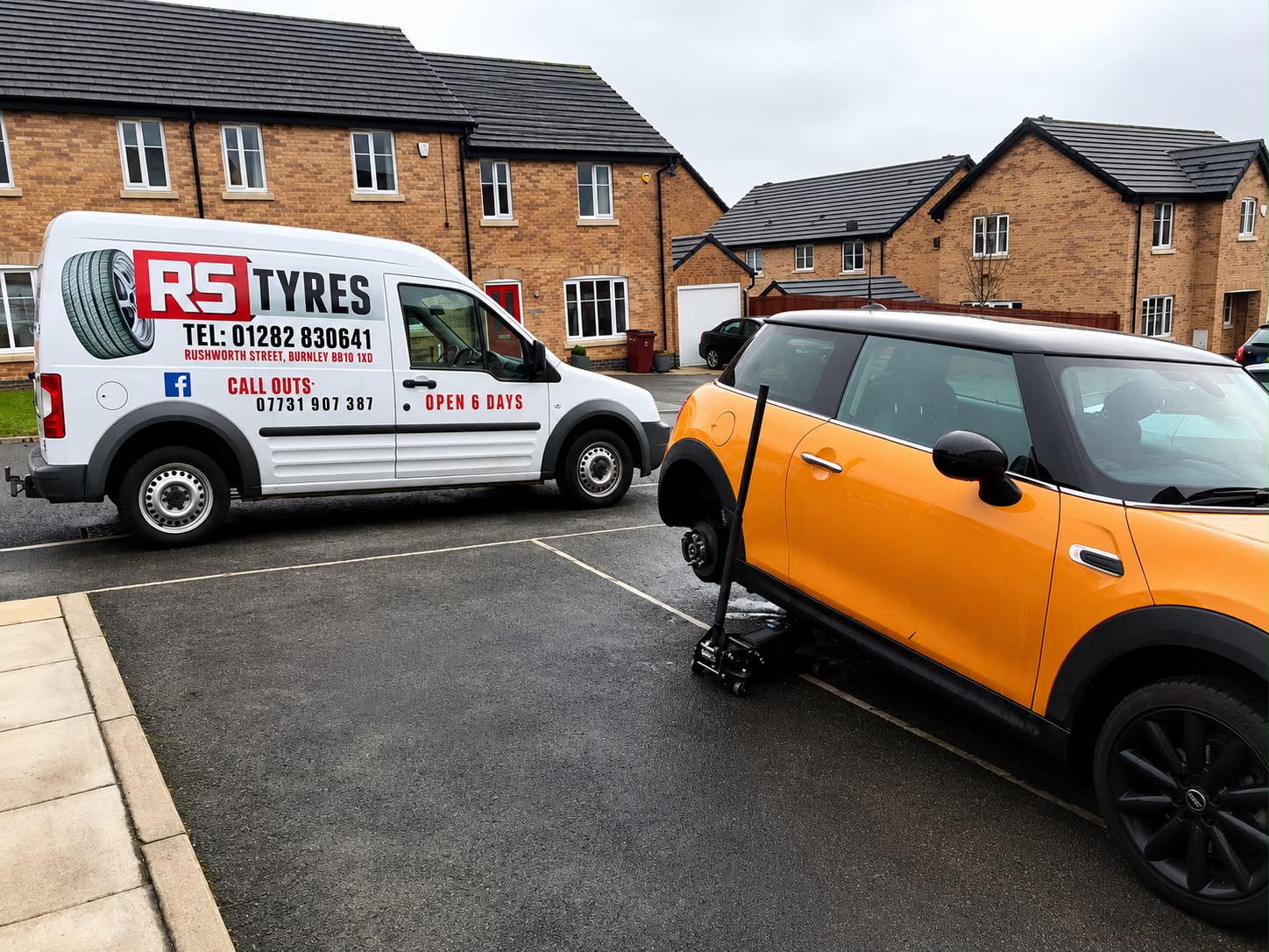 RS Tyres van out on a callout, wheel off a Mini on the driveway