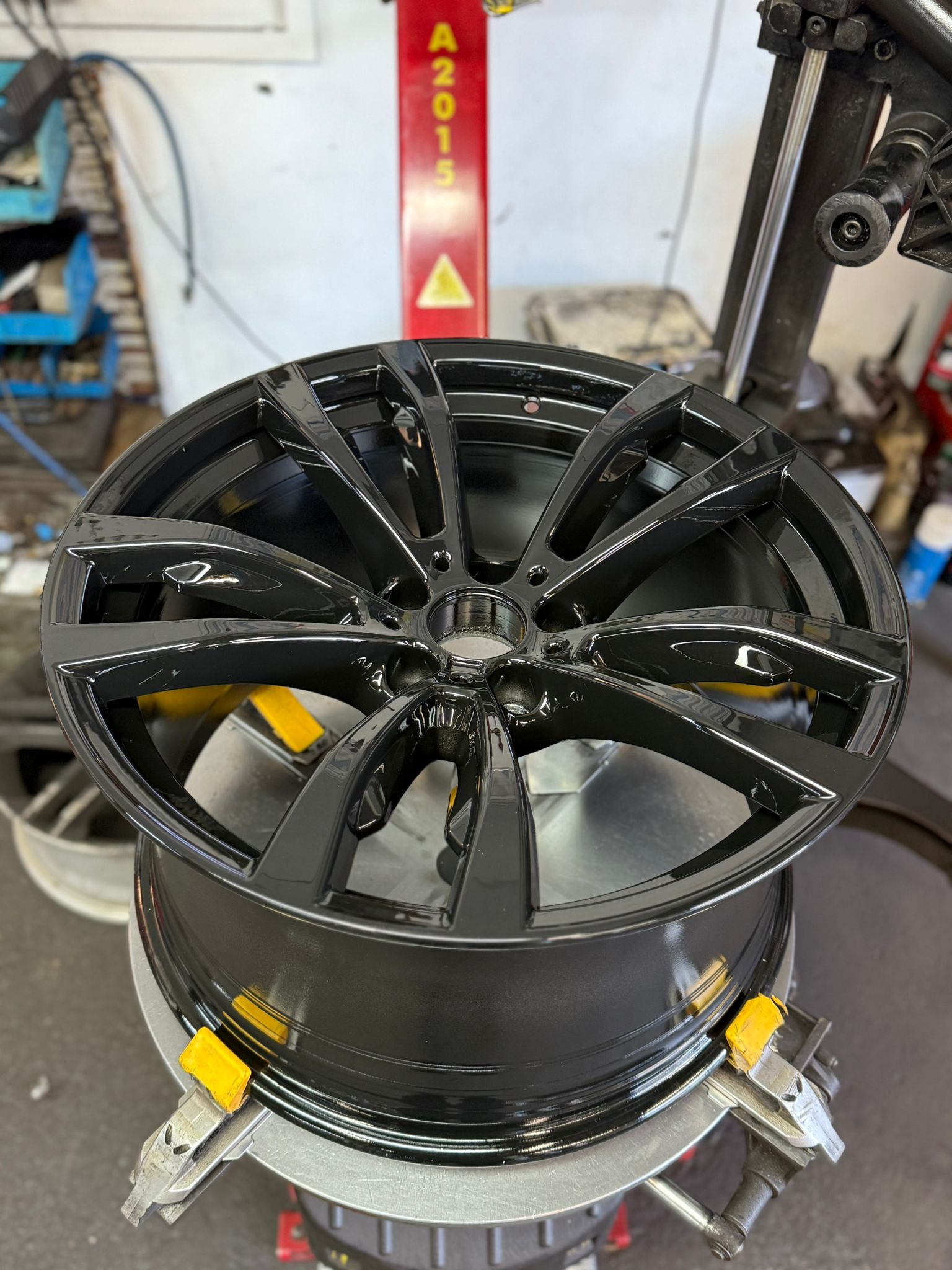 BMW alloy powder-coated in a deep gloss black — Burnley
