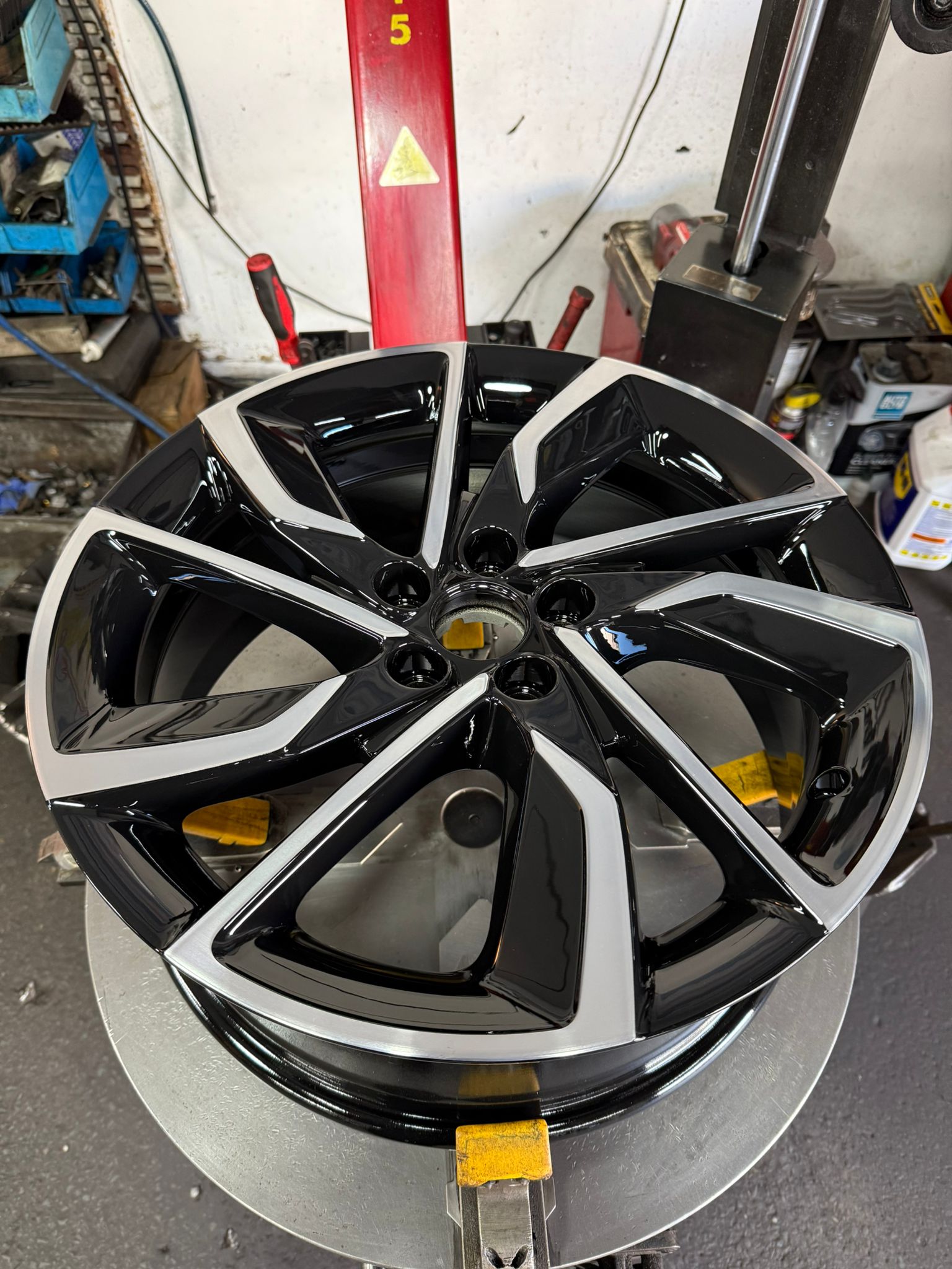 10-spoke alloy diamond cut with a machined face and gloss black spokes — Burnley