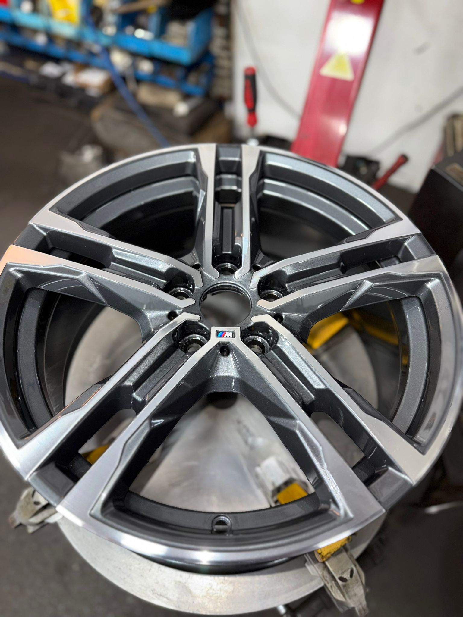 BMW M alloy diamond cut to a bright machined face and refinished in gunmetal — Burnley