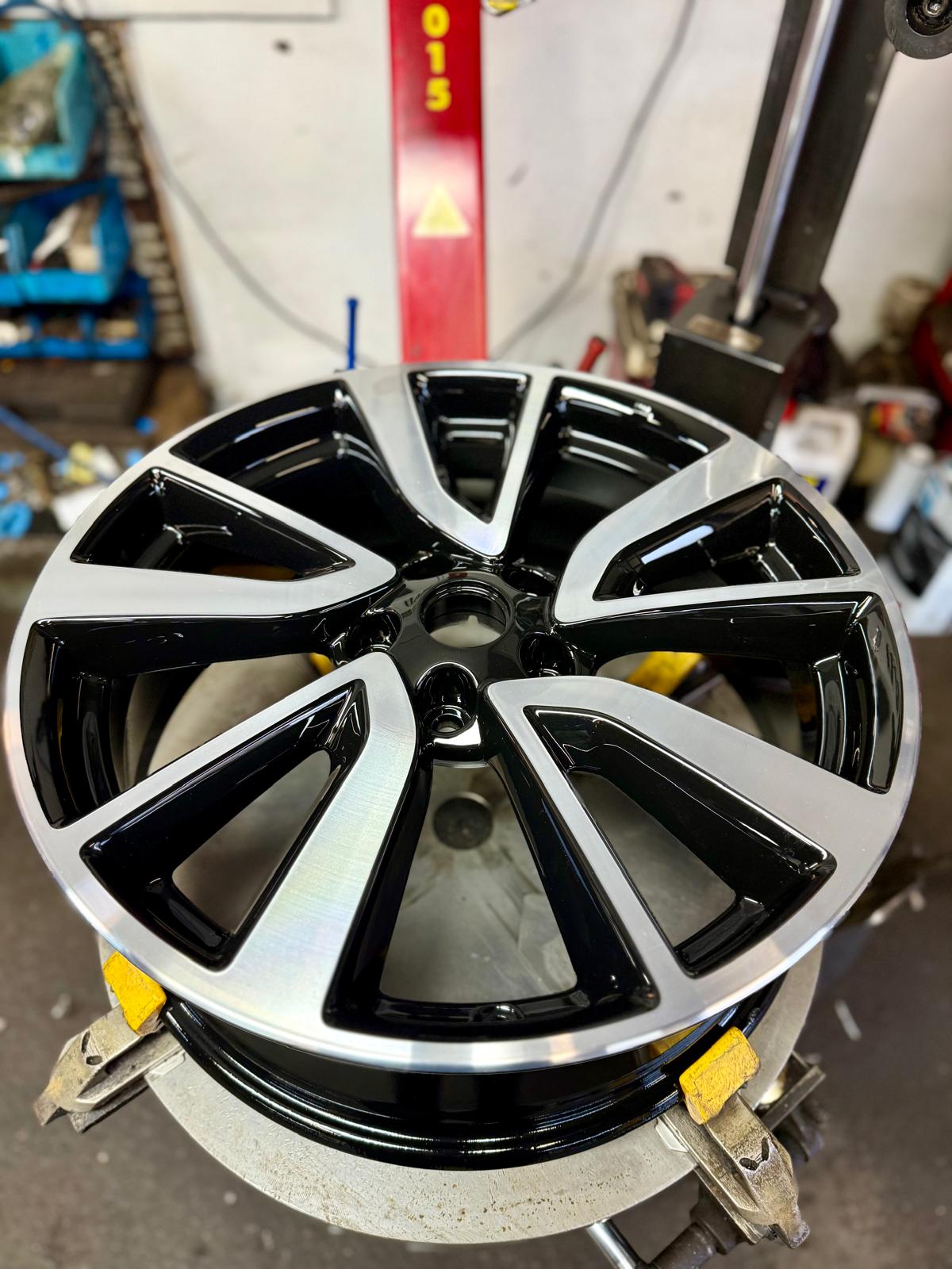 Two-tone diamond-cut alloy with a bright machined face and gloss black spokes — Burnley